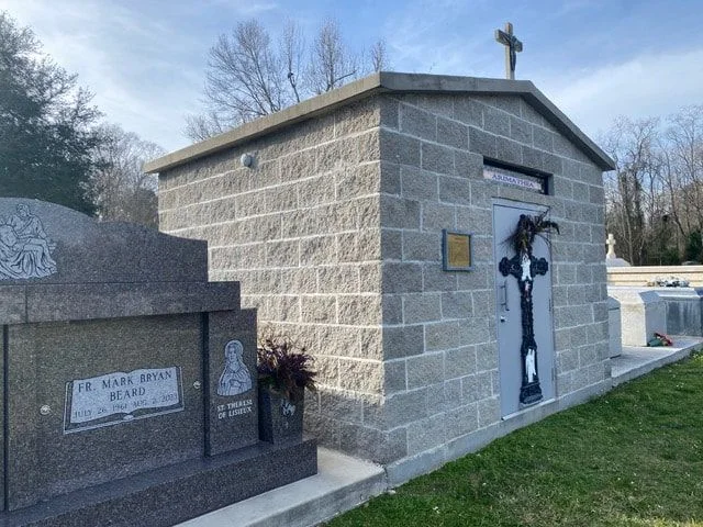 Arimathea Paupers Tomb with the Father Mark Beard memorial beside it