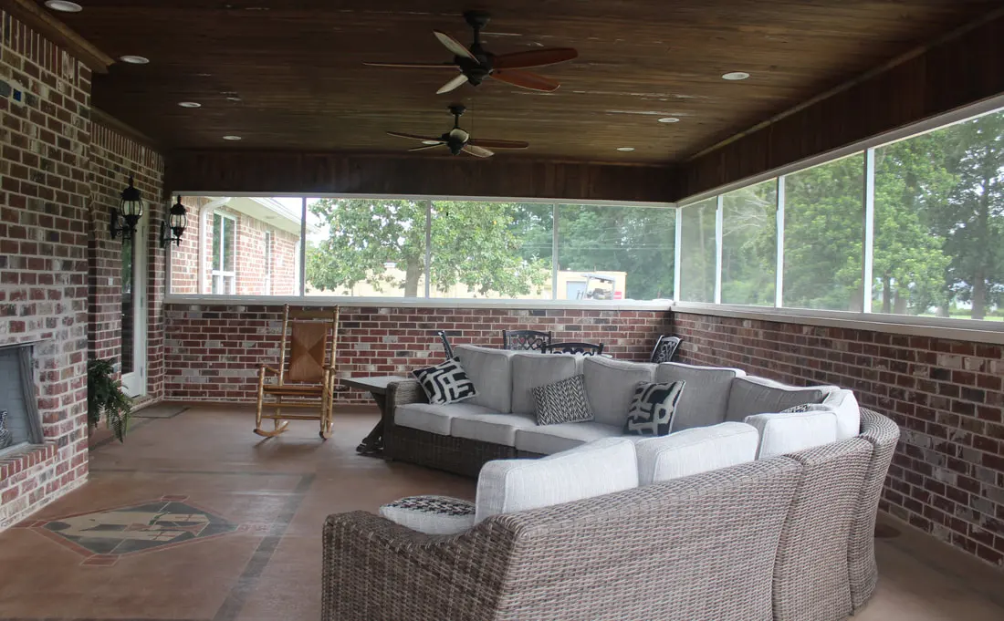 Covered screened patio at Vianney Villa with comfortable seating